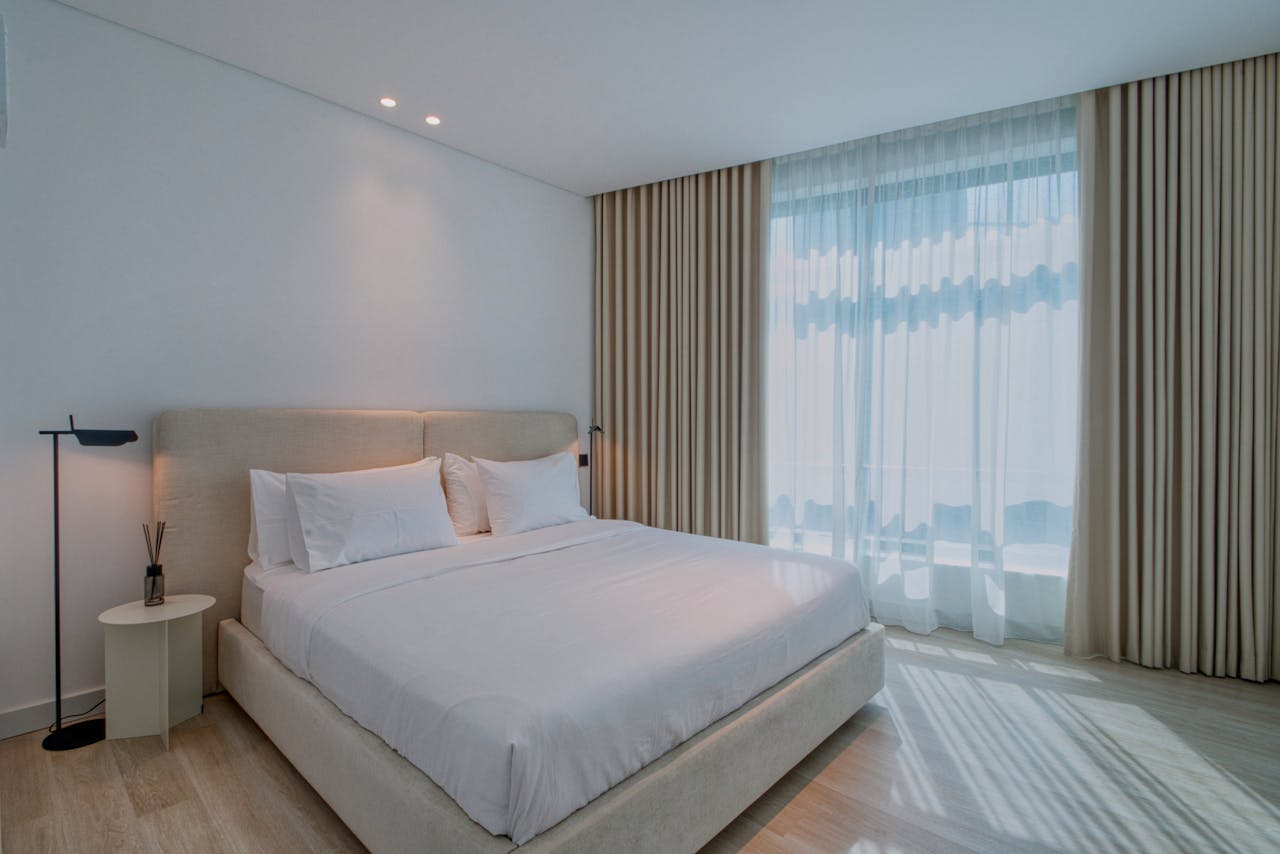 Contemporary bedroom design with soft lighting and a serene atmosphere.